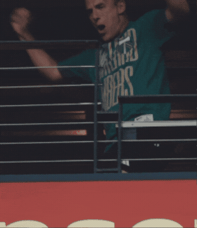 A Man In A Green Shirt That Says ' Washington ' On It GIF