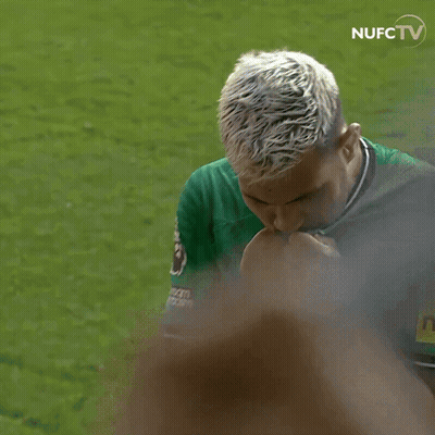 A Man In A Green Shirt With A Yellow Patch That Says Neon GIF