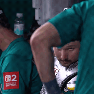 A Man In A Green Shirt With The Number 082 On The Sleeve GIF