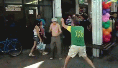 A Man In A Green Shirt With The Number 10 On It Is Dancing GIF