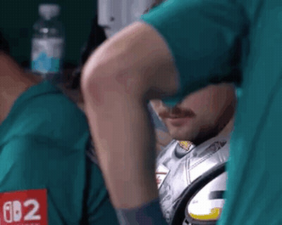 A Man In A Green Shirt With The Number 62 On It GIF