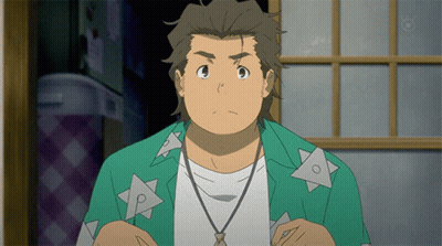 A Man In A Green Shirt With Triangles On It Is Looking At The Camera GIF