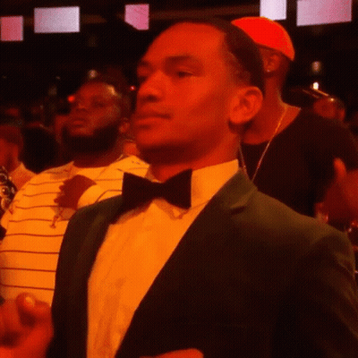 A Man In A Green Suit And Bow Tie GIF