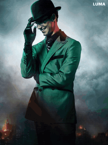 A Man In A Green Suit And Top Hat Is Standing In Front Of A Luma Sign GIF