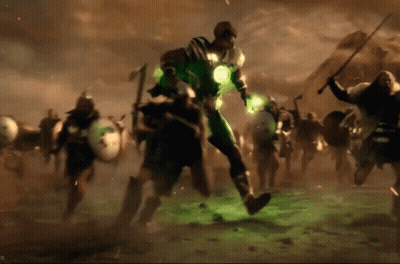 A Man In A Green Suit Is Surrounded By A Group Of Men GIF