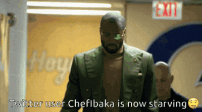 A Man In A Green Suit Walks Down A Hallway With The Words Twitter User Chefibaka Is Now Starving GIF