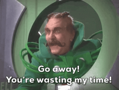 A Man In A Green Suit With A Mustache Says Go Away You 'Re Wasting My Time GIF