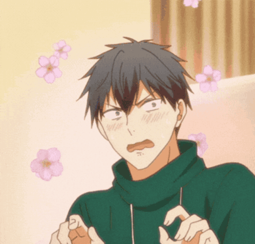 A Man In A Green Sweater Is Making A Funny Face With Flowers Behind Him GIF