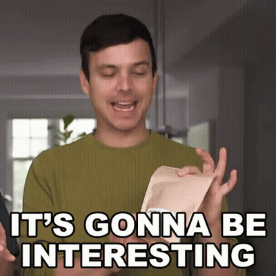 A Man In A Green Sweater Says It 'S Gonna Be Interesting While Holding A Piece Of Paper GIF