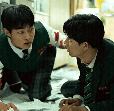 A Man In A Green Vest And Tie Has The Letter K On His Pocket GIF