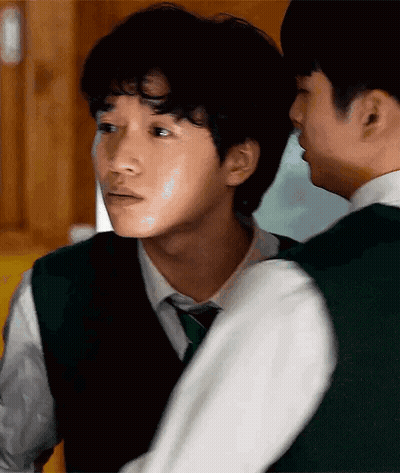 A Man In A Green Vest And Tie Is Standing Next To Another Man In A White Shirt GIF
