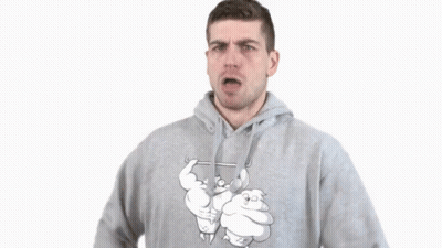 A Man In A Grey Hoodie Is Making A Gesture GIF