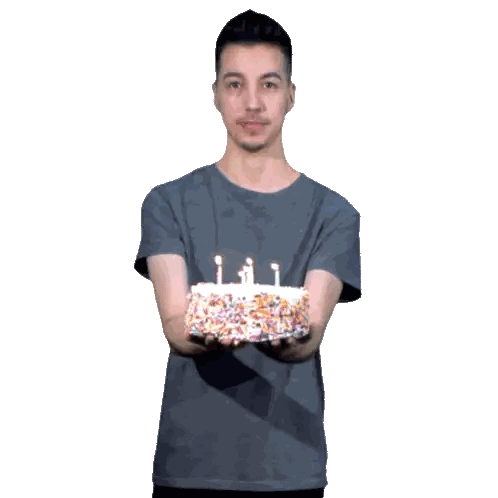 A Man In A Grey Shirt Is Holding A Birthday Cake Sticker