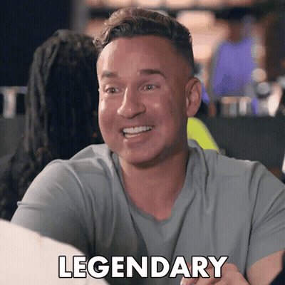 A Man In A Grey Shirt Is Smiling And The Word Legendary Is On The Bottom GIF
