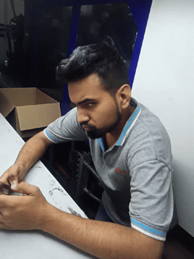 A Man In A Grey Shirt With The Word Columbia On The Front GIF