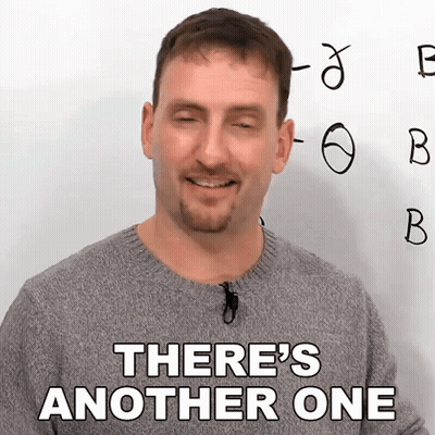 A Man In A Grey Sweater Says There 'S Another One In Front Of A White Board GIF