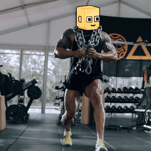 A Man In A Gym With A Box On His Face GIF
