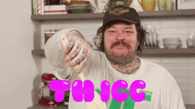 A Man In A Harley Davidson Hat Is Holding A Spoon In His Hand GIF