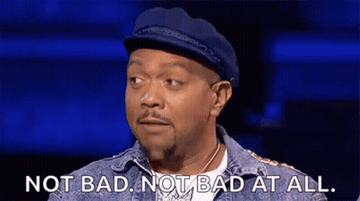 A Man In A Hat And Denim Jacket Is Saying `` Not Bad , Not Bad At All '' . GIF