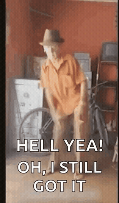 A Man In A Hat Is Dancing In A Garage With The Words `` Hell Yea Oh , I Still Got It '' . GIF