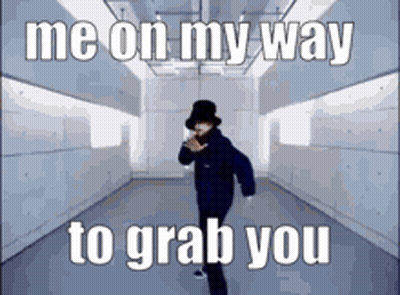 A Man In A Hat Is Dancing In A Hallway With The Words Me On My Way To Grab You . GIF