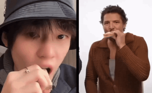 A Man In A Hat Is Eating A Sandwich Next To Another Man GIF