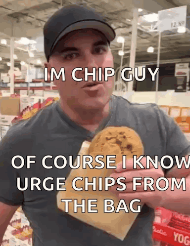A Man In A Hat Is Holding A Bag Of Chips And Says Im Chip Guy GIF