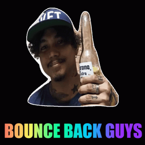 A Man In A Hat Is Holding A Corona Beer GIF