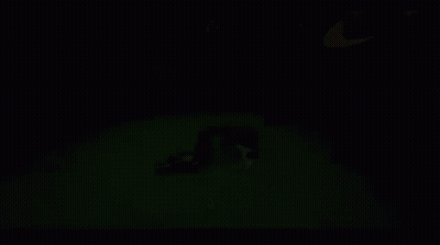 A Man In A Hat Is Playing Poker With A Gun On The Table GIF