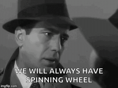 A Man In A Hat Is Saying `` We Will Always Have Spinning Wheel '' In A Black And White Photo . GIF