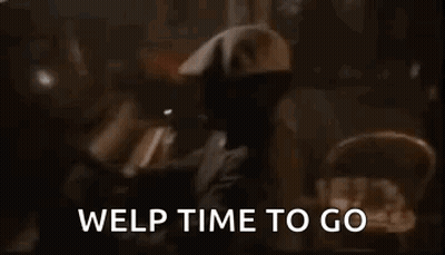 A Man In A Hat Is Standing In A Dark Room With The Words `` Welp Time To Go '' Written Above Him . GIF