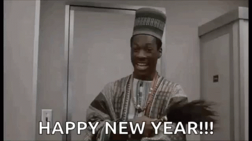 A Man In A Hat Is Standing In Front Of A Door And Saying `` Happy New Year ! '' GIF