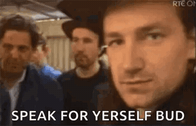 A Man In A Hat Is Standing In Front Of A Group Of Men And Says `` Speak For Yerself Bud '' . GIF