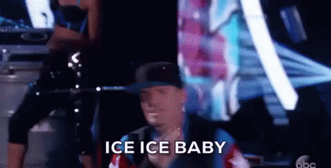 A Man In A Hat Is Standing In Front Of A Group Of People And Says Ice Ice Baby . GIF