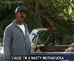A Man In A Hat Is Standing Next To A Car And Saying Cause I 'M A Nasty Muthafucka GIF