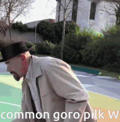 A Man In A Hat Is Standing On A Basketball Court With The Words Common Goro Pilk W Written Below Him GIF