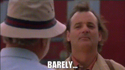 A Man In A Hat Is Talking To Another Man Who Says Barely .. GIF