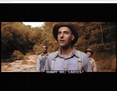 A Man In A Hat Says Howdy Do Ladies In Front Of Two Other Men GIF