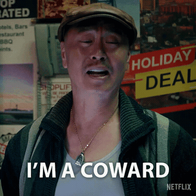A Man In A Hat Says I 'M A Coward GIF