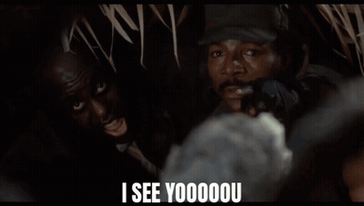 A Man In A Hat Says " I See Yoooou " In Front Of A Group Of People GIF