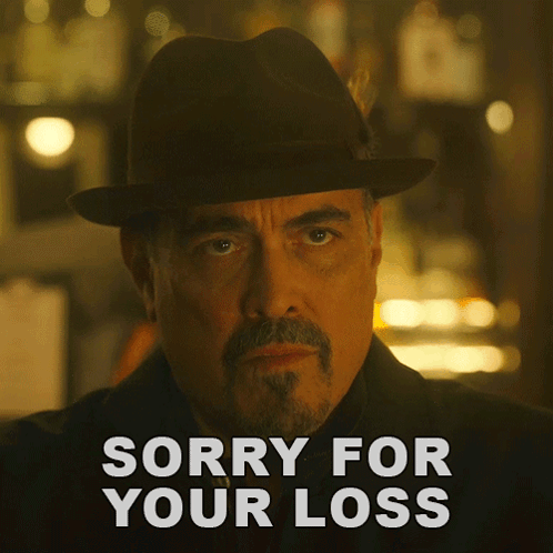 A Man In A Hat Says Sorry For Your Loss In White Letters GIF