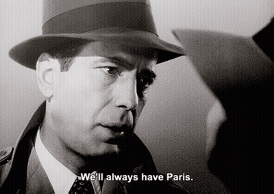 A Man In A Hat Says " We 'Ll Always Have Paris " In A Black And White Photo GIF
