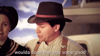 A Man In A Hat Says " Woulda Done That Boy Some Good " Next To A Woman GIF