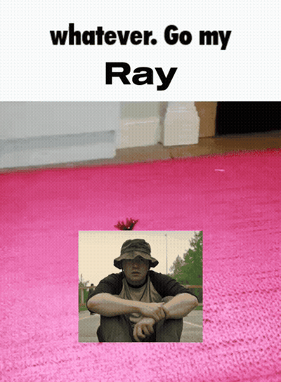 A Man In A Hat Sits On A Pink Rug With The Words " Whatever Go My Ray " Below Him GIF