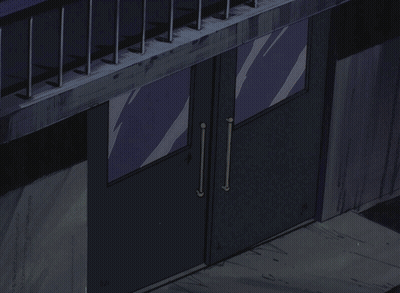 A Man In A Hat Stands In A Doorway GIF