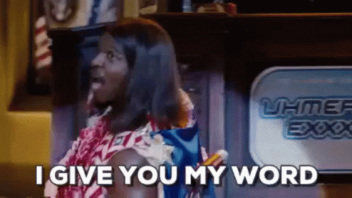 A Man In A Hawaiian Outfit Is Standing In Front Of A Fireplace And Says `` I Give You My Word '' . GIF