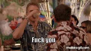 A Man In A Hawaiian Shirt Is Drinking From A Glass And Says Fuck You . GIF