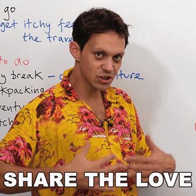 A Man In A Hawaiian Shirt Is Standing In Front Of A Whiteboard That Says Share The Love GIF