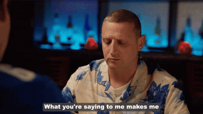 A Man In A Hawaiian Shirt Is Talking To Another Man And Says What You 'Re Saying To Me Makes Me GIF