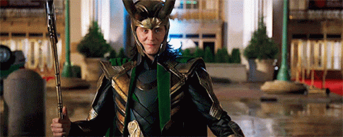 A Man In A Helmet And Armor Is Holding A Spear And Giving A Thumbs Up GIF